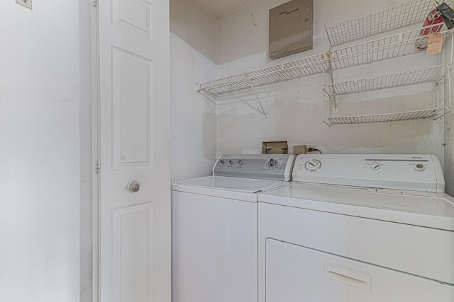 laundry room with washing machine and dryer