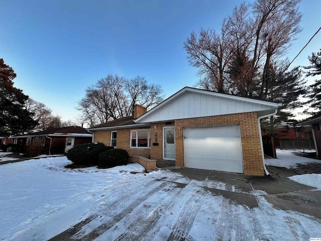 ranch-style house featuring a garage