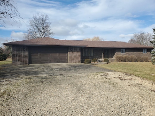 single story home featuring a garage and a front yard