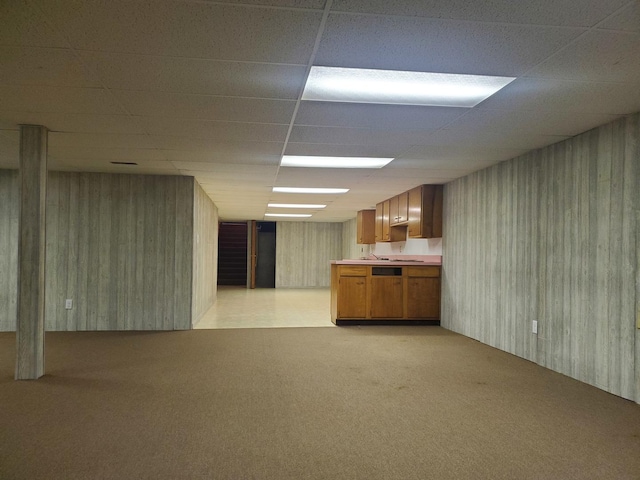 interior space with light carpet and a drop ceiling