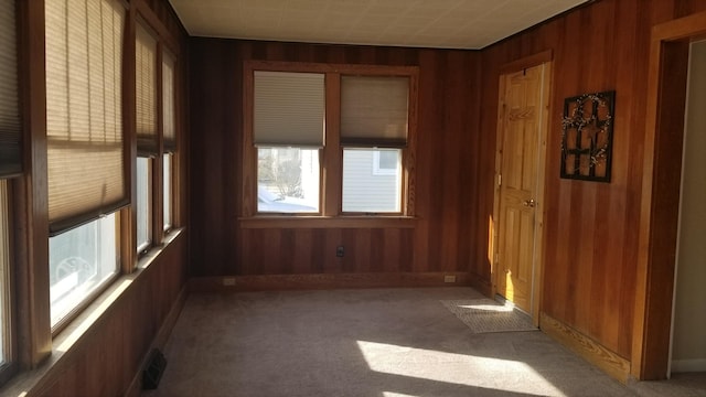 unfurnished sunroom with visible vents