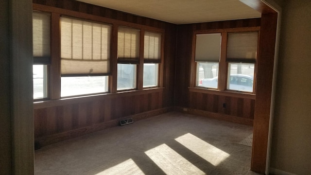 unfurnished sunroom with visible vents