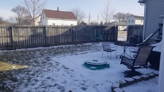 snow covered patio with fence