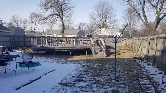 exterior space featuring a fenced backyard and a wooden deck