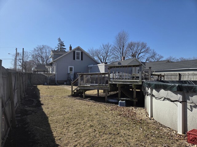 wooden deck featuring outdoor dining area and fence