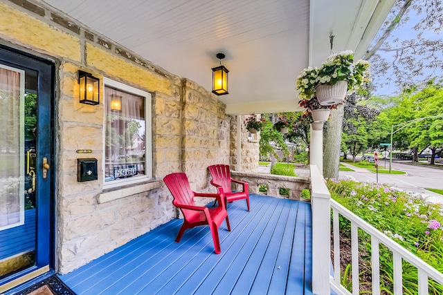 wooden deck featuring covered porch