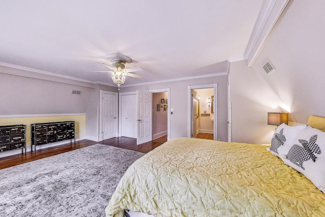 bedroom featuring baseboards, crown molding, visible vents, and dark wood-type flooring