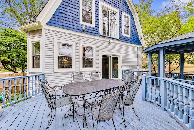 wooden deck with outdoor dining area