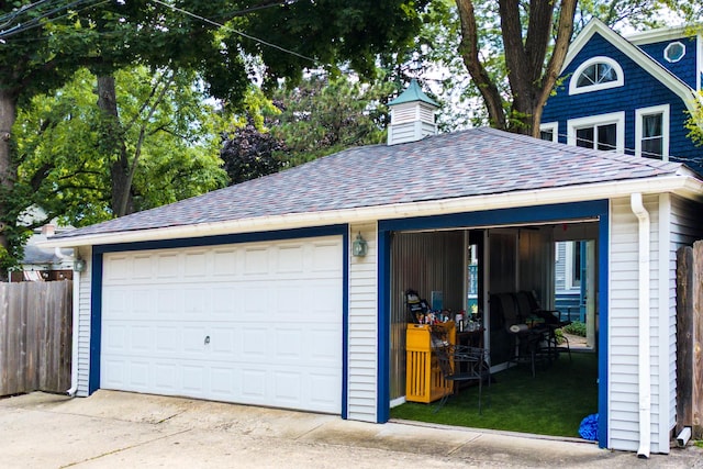 detached garage with fence