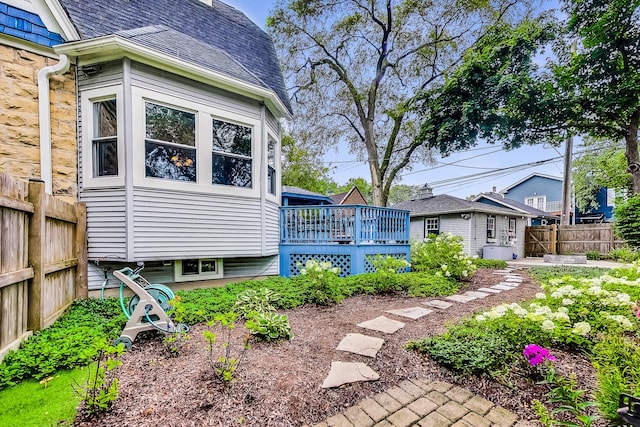 view of yard featuring fence and a wooden deck