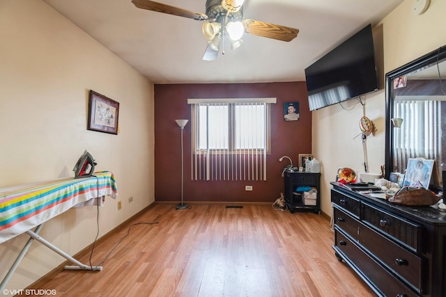 interior space featuring ceiling fan and light wood-type flooring