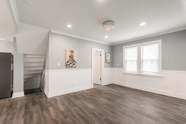 interior space with dark wood-type flooring and ornamental molding