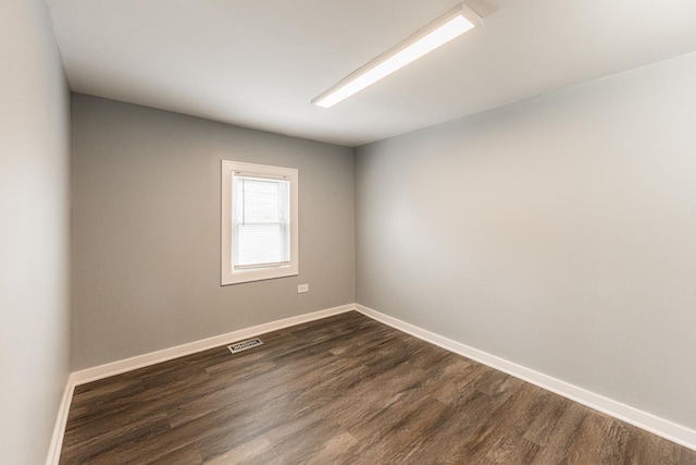 empty room featuring dark hardwood / wood-style floors