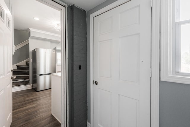 hallway with dark hardwood / wood-style flooring