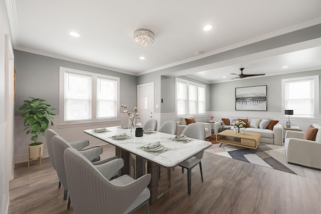 dining room with crown molding and dark wood-type flooring