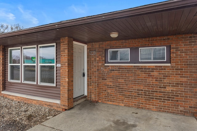 property entrance with a patio