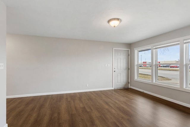 spare room featuring dark hardwood / wood-style flooring