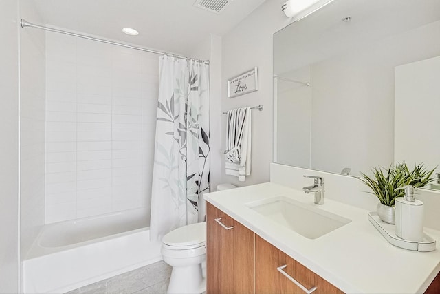 full bathroom with shower / tub combo, vanity, tile patterned floors, and toilet