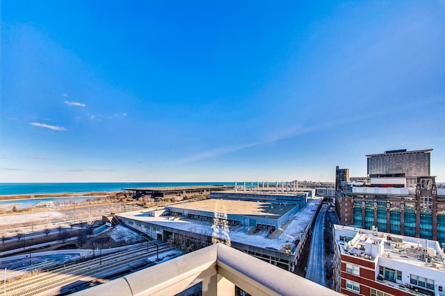 surrounding community with a water view and a view of the beach