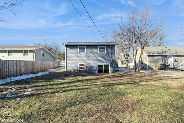 back of property featuring a yard