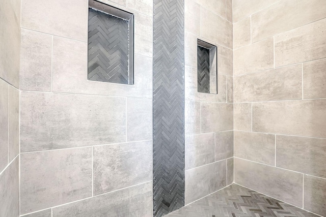 interior space featuring a tile shower