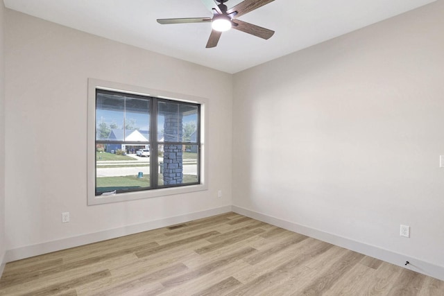 spare room with light hardwood / wood-style floors and ceiling fan