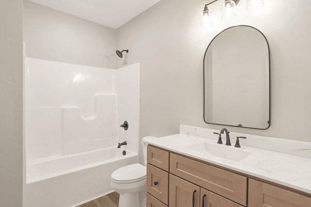 full bathroom with toilet, vanity, bathtub / shower combination, and hardwood / wood-style floors