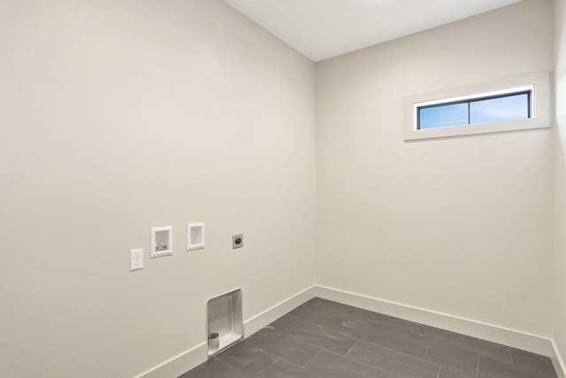 laundry room featuring washer hookup, hookup for an electric dryer, and dark tile patterned floors