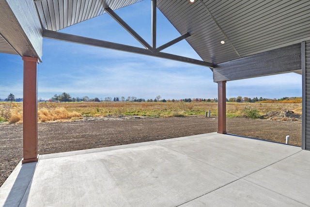 view of patio / terrace with a rural view