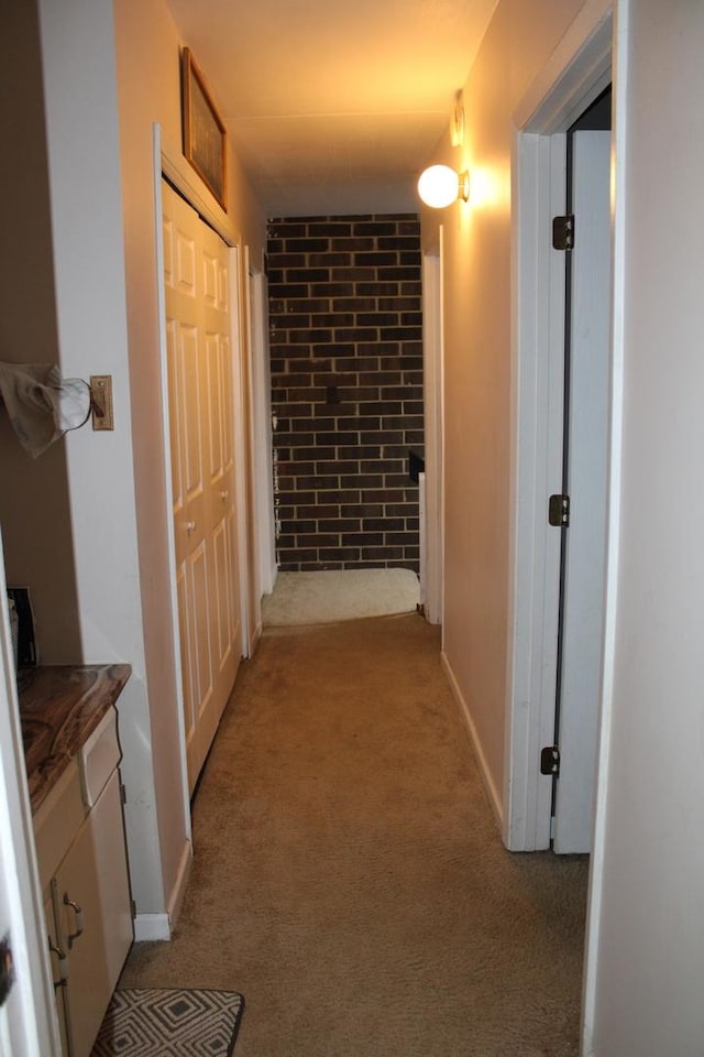 hallway featuring light carpet