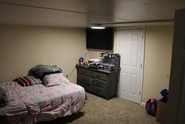 bedroom featuring light carpet