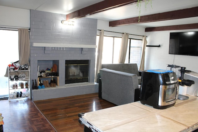 living room featuring a fireplace and beam ceiling