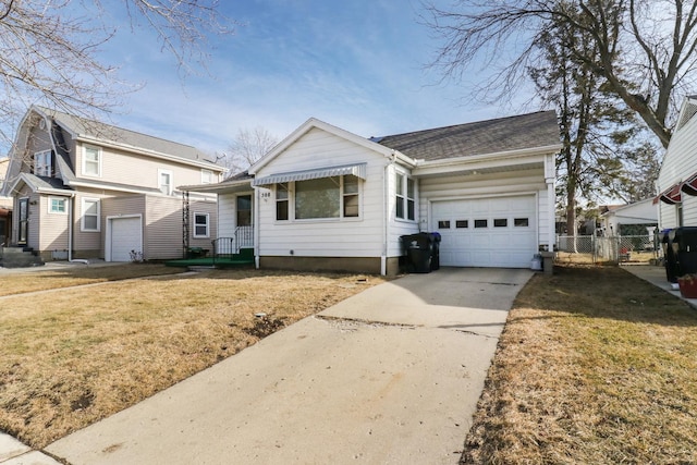 view of front of property featuring a garage and a front yard