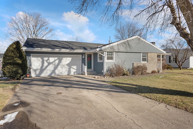 ranch-style house featuring a garage and a front yard