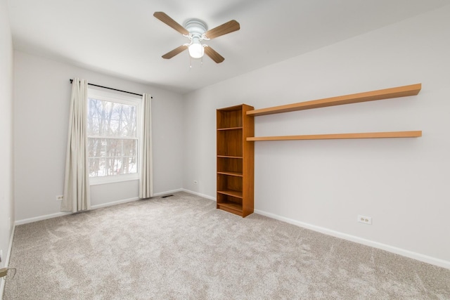 interior space with ceiling fan