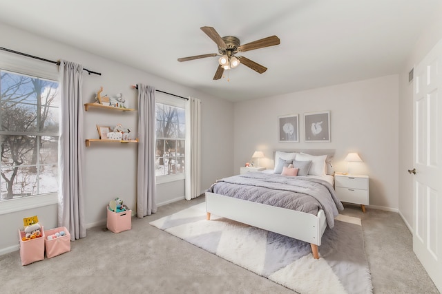 carpeted bedroom featuring ceiling fan