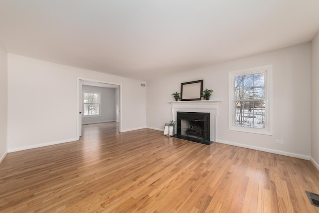 unfurnished living room featuring light hardwood / wood-style floors