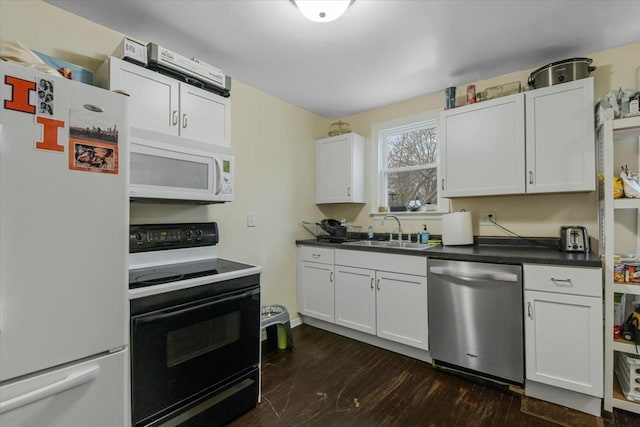 kitchen featuring dark wood-type flooring, white appliances, sink, and white cabinets