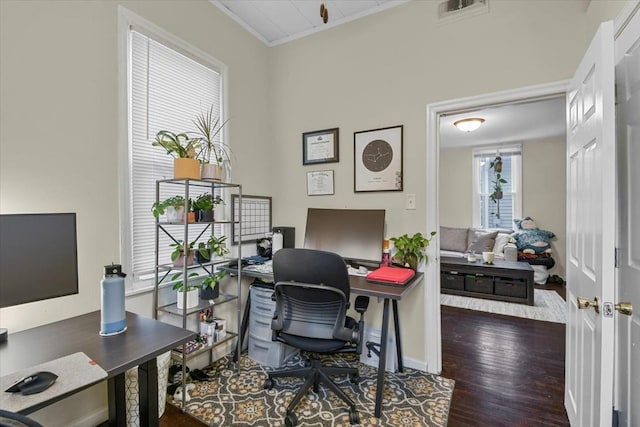 office area featuring dark hardwood / wood-style flooring and crown molding