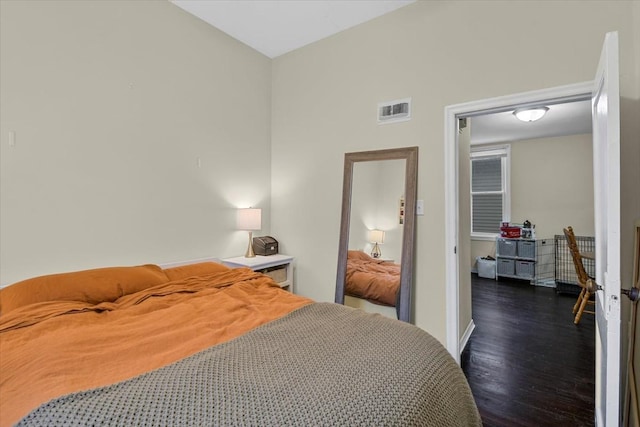 bedroom featuring dark wood-type flooring