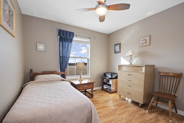 bedroom with ceiling fan and light wood-type flooring