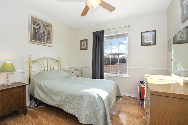 bedroom with light wood-type flooring and ceiling fan