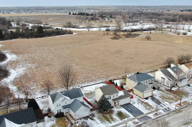 snowy aerial view featuring a rural view