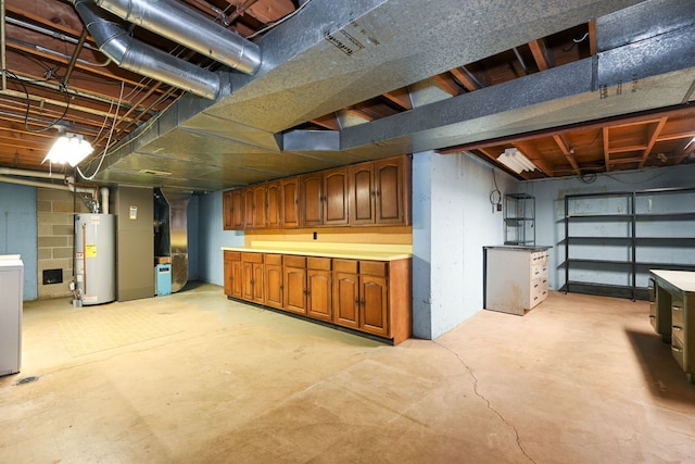 basement featuring washer / clothes dryer and gas water heater