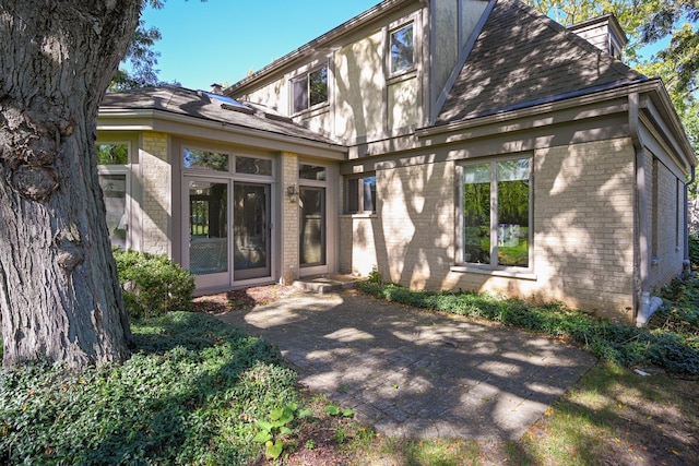 rear view of property with a patio area