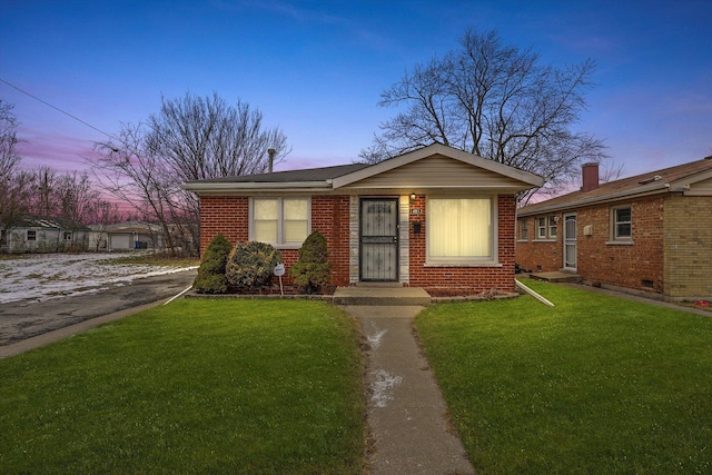 view of front of property with a yard