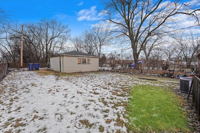 yard layered in snow featuring central AC