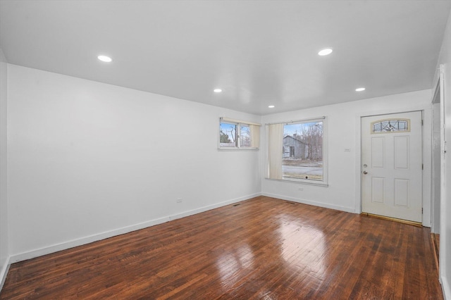 entryway with dark hardwood / wood-style floors