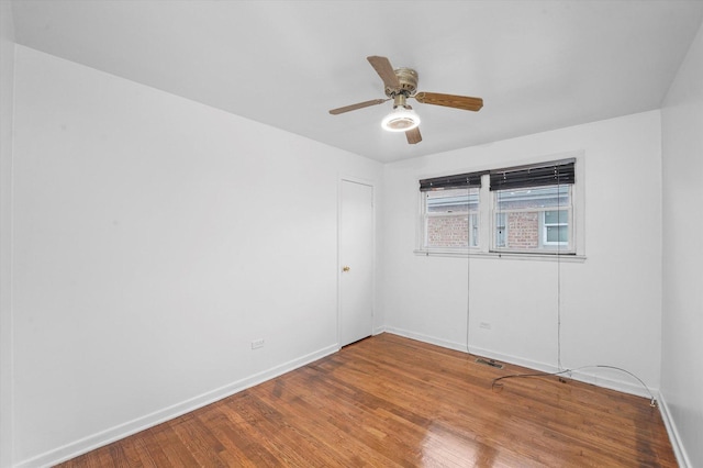 empty room featuring ceiling fan and wood-type flooring