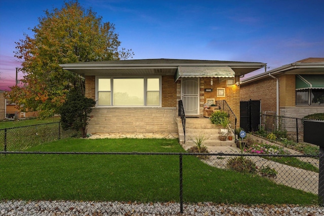 view of front of house with a lawn